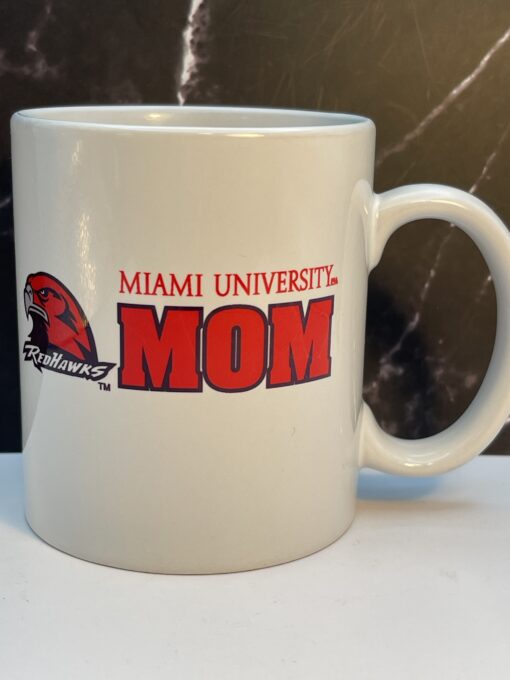 Start your mornings with the Miami RedHawks Mom Ceramic Coffee Mug! It's the perfect #cupofmood of school spirit and caffeine delivery system.