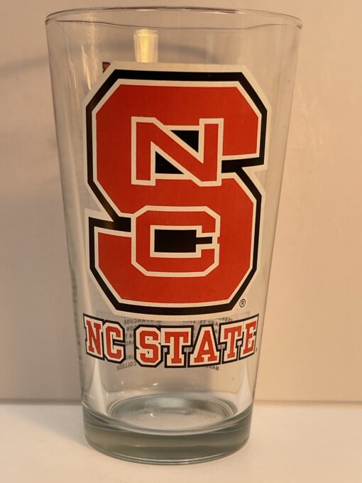 Raise a toast to Wolfpack pride with the NC State Wolfpack Basketball Pint Glass. It's the perfect collectible #cupofmood for any fans of NC State hoops!