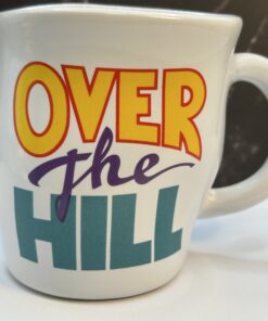Say hello to witty sips—with the Papel Over the Hill Retirement Coffee Mug. It's the perfect #cupofmood to wave goodbye to work.