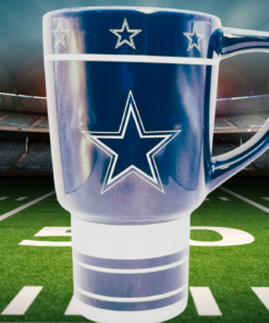 Dallas Cowboys sculpted star travel mug displayed on a football field under stadium lights