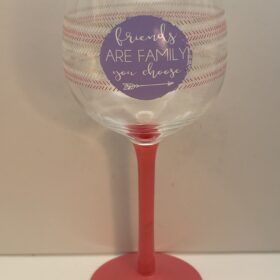 Decorative lavender wine glass with "friends are family" quote