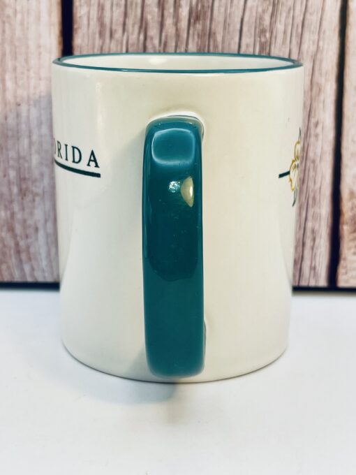 White ceramic USF floral mug