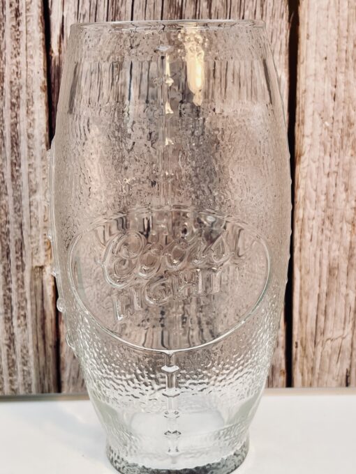 Clear stemless wine glass shaped like football