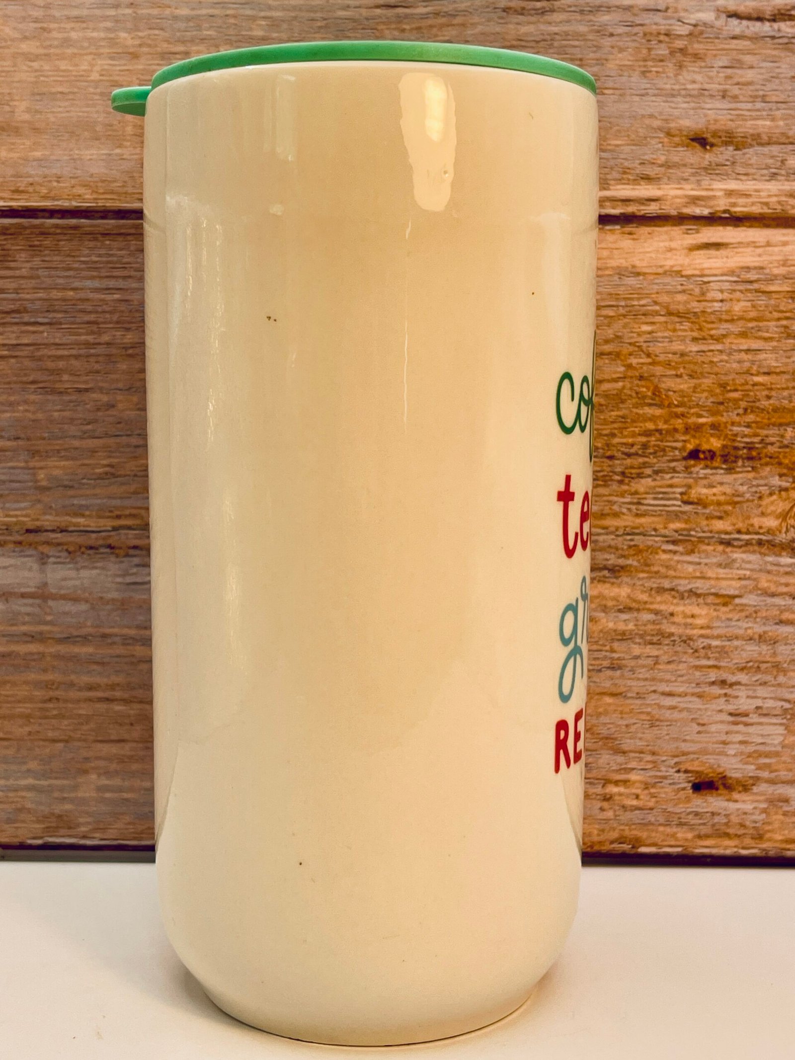 White teacher tumbler with green lid