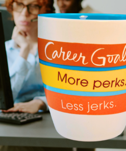 Hallmark Career Goals coffee mug with retro stripes and workplace humor on an office desk