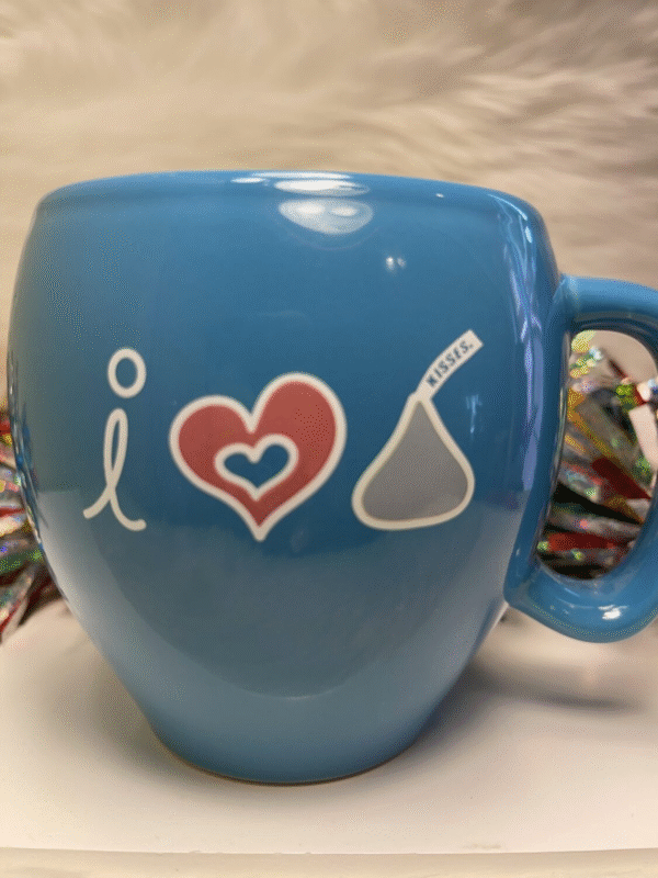 Chocolate lovers will appreciate the whimsical design on this large blue I Love Kisses Mug.