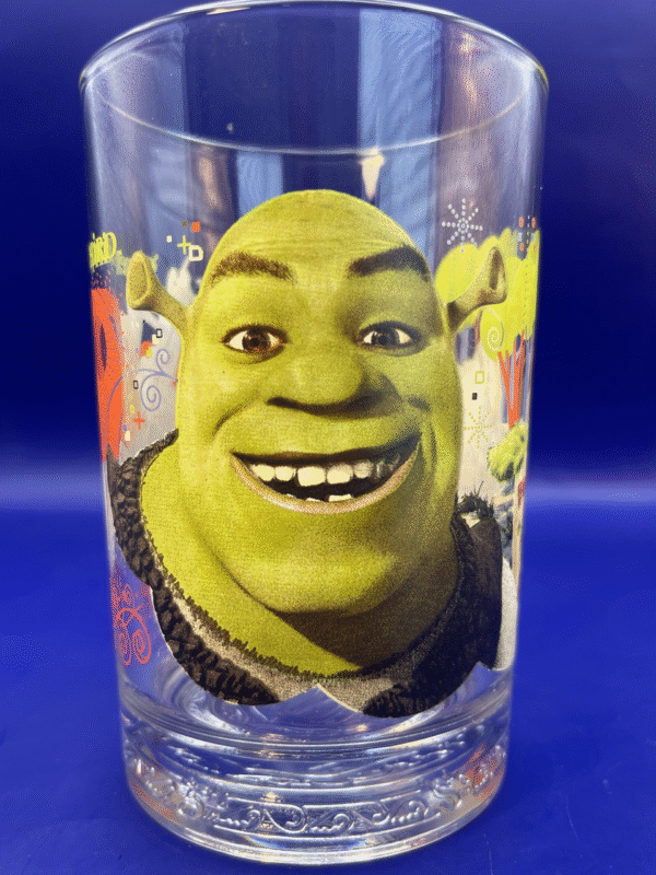 Collector’s gem is the heartwarming image of Shrek, Donkey, and Puss In Boots soaring through the air on a rope