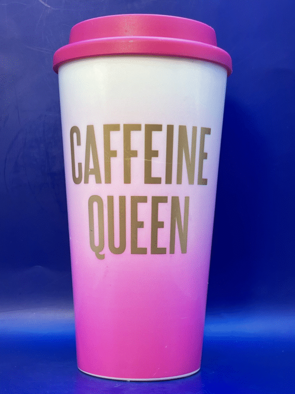 Pink acrylic Caffeine Queen Travel Mug with Lid says Caffeine Queen on the front.