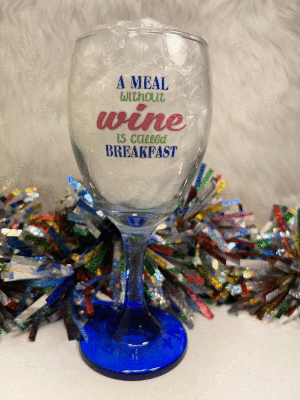 Beautiful wine glass with a blue stem and funny saying. 