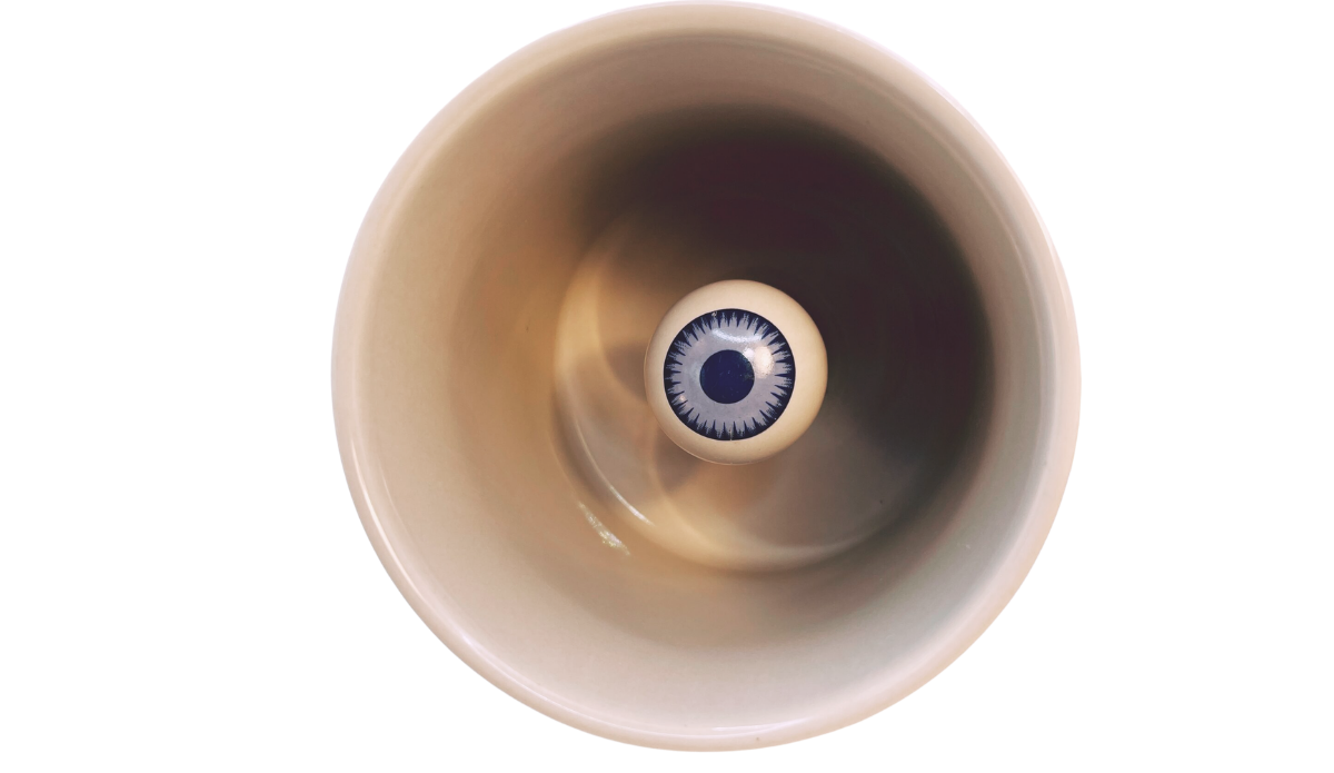 3D Eyeball Mug inside detail view showing the sculpted blue iris and dark pupil at the bottom of the mug.
