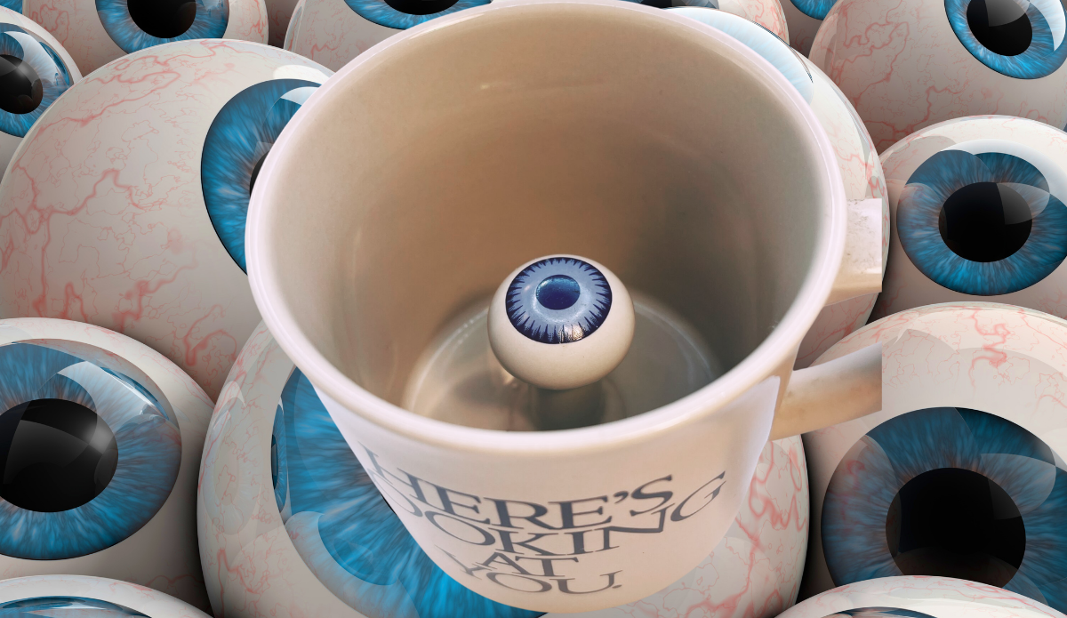 3D Eyeball Mug displayed among oversized blue eyeballs with its hidden interior eye clearly visible.