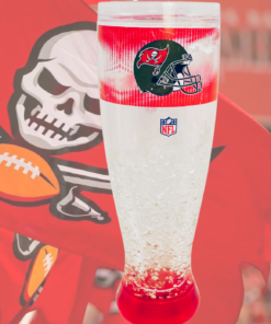 Tampa Bay Buccaneers freezer pilsner glass displayed with large Buccaneers flag at football stadium