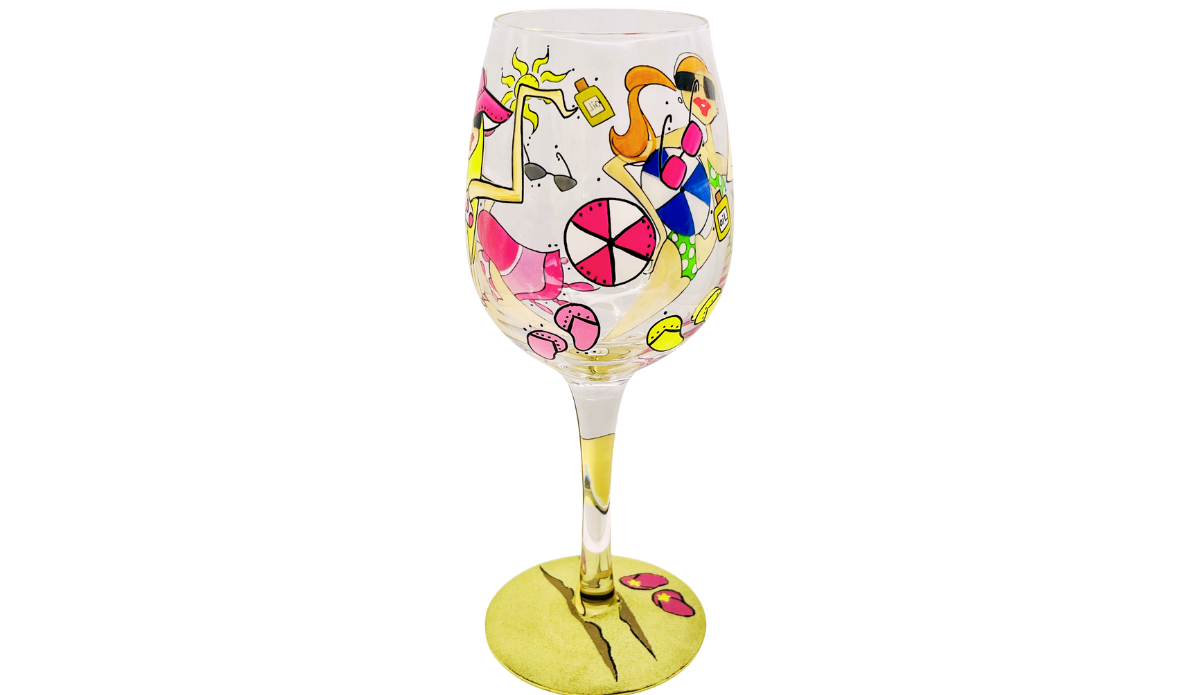 Beach Girls Hand Painted Wine Glass showing beach ball, sunglasses, sun, sunscreen bottle, lemons, and flip flops