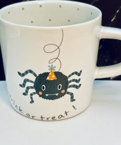 Spider in party hat coffee cup