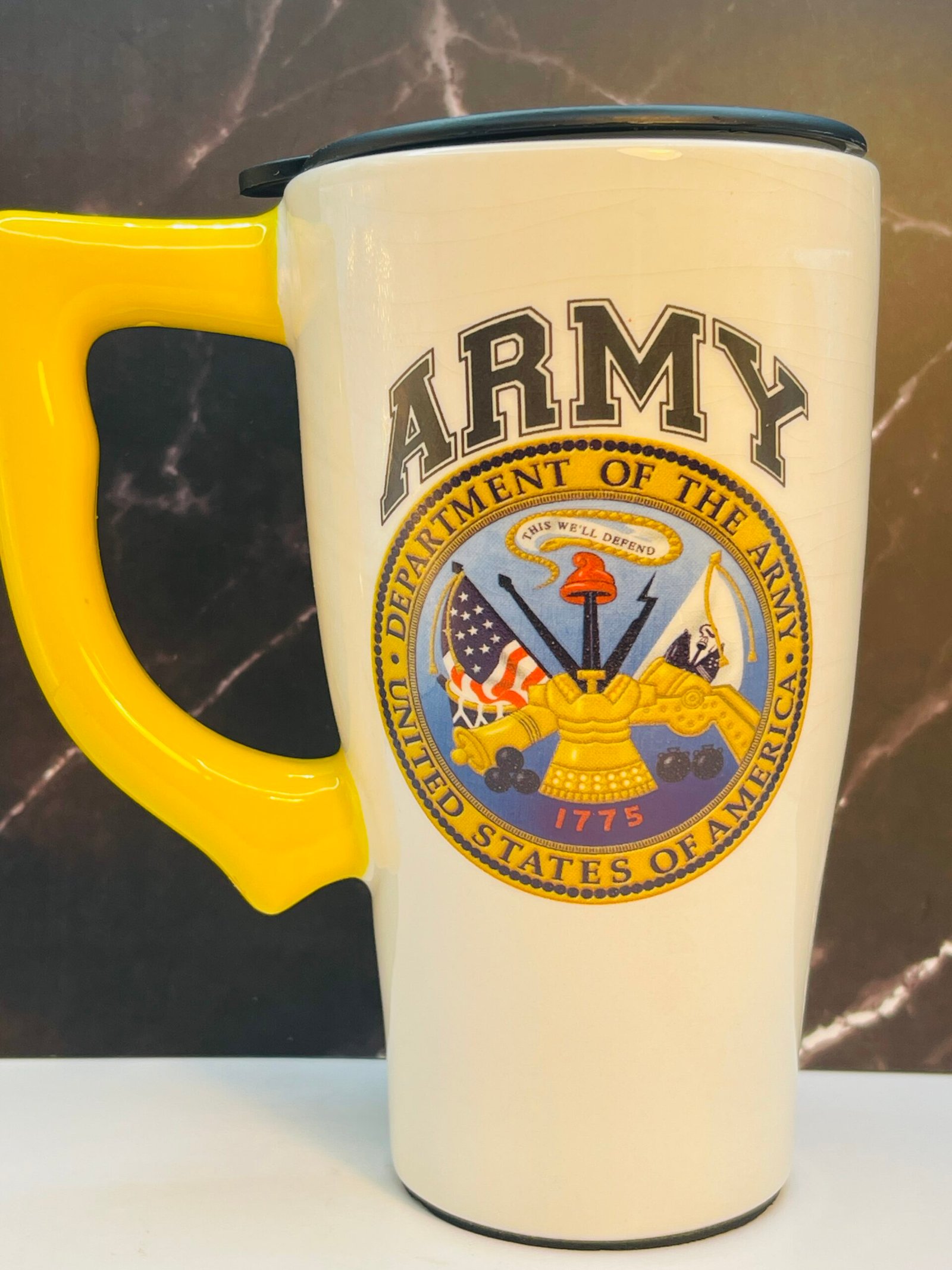 U.S. Army ceramic travel mug with yellow handle and black lid