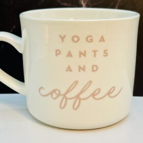 White stoneware mug with pink lettering for coffee