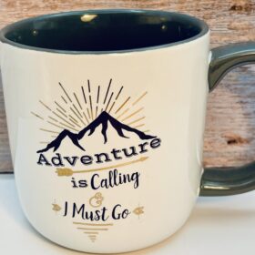 Adventure Is Calling Mountain Coffee Mug with sunburst design