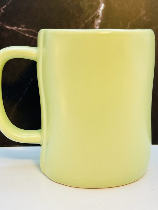 Light green Rae Dunn Hop Into Spring coffee cup