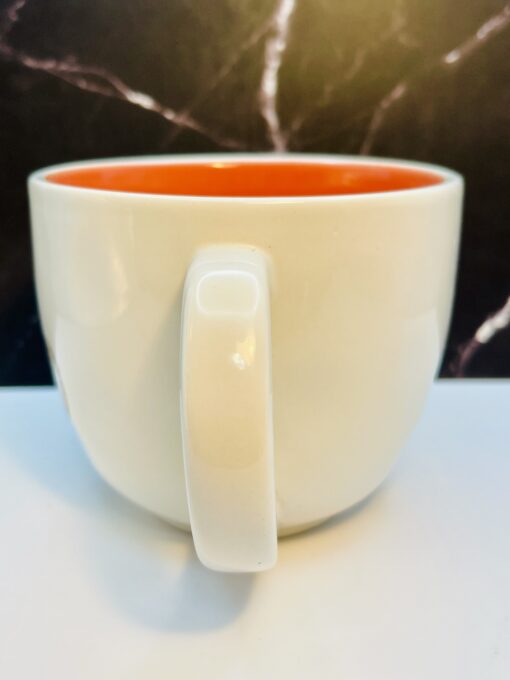 Rae Dunn ceramic mug with bicycle design