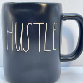 Rae Dunn Hustle black ceramic mug front view