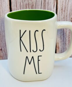 Rae Dunn Kiss Me Mug with embossed green lettering