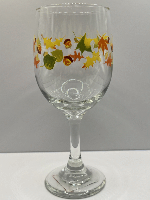 Celebrate the breathtaking beauty of autumn with the Fall Leaves Acorns Wine Glass from the spectacular fall drinkware collection.
