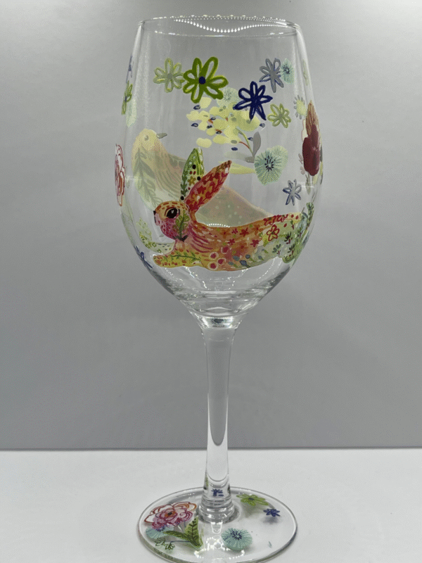 Get ready to brighten up your wine time with the playful charm of our Birds Bunny Flowers Wine Glass!