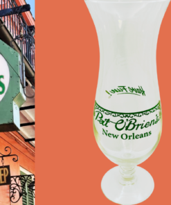 Vintage Pat O’Brien’s New Orleans Hurricane Glass styled in front of a New Orleans street scene with wrought-iron balcony details