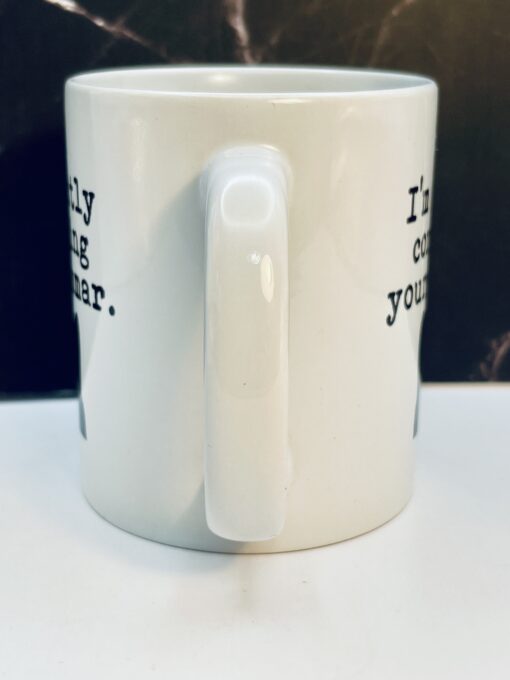 White ceramic grammar mug with cat design