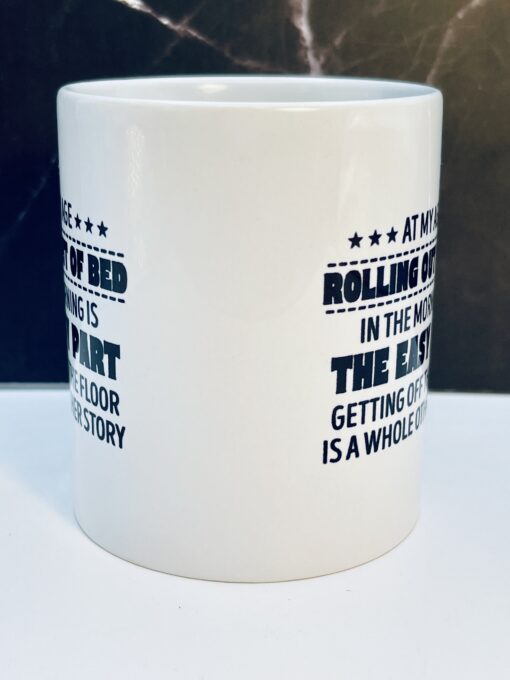 Side view of At My Age mug showing black lettering