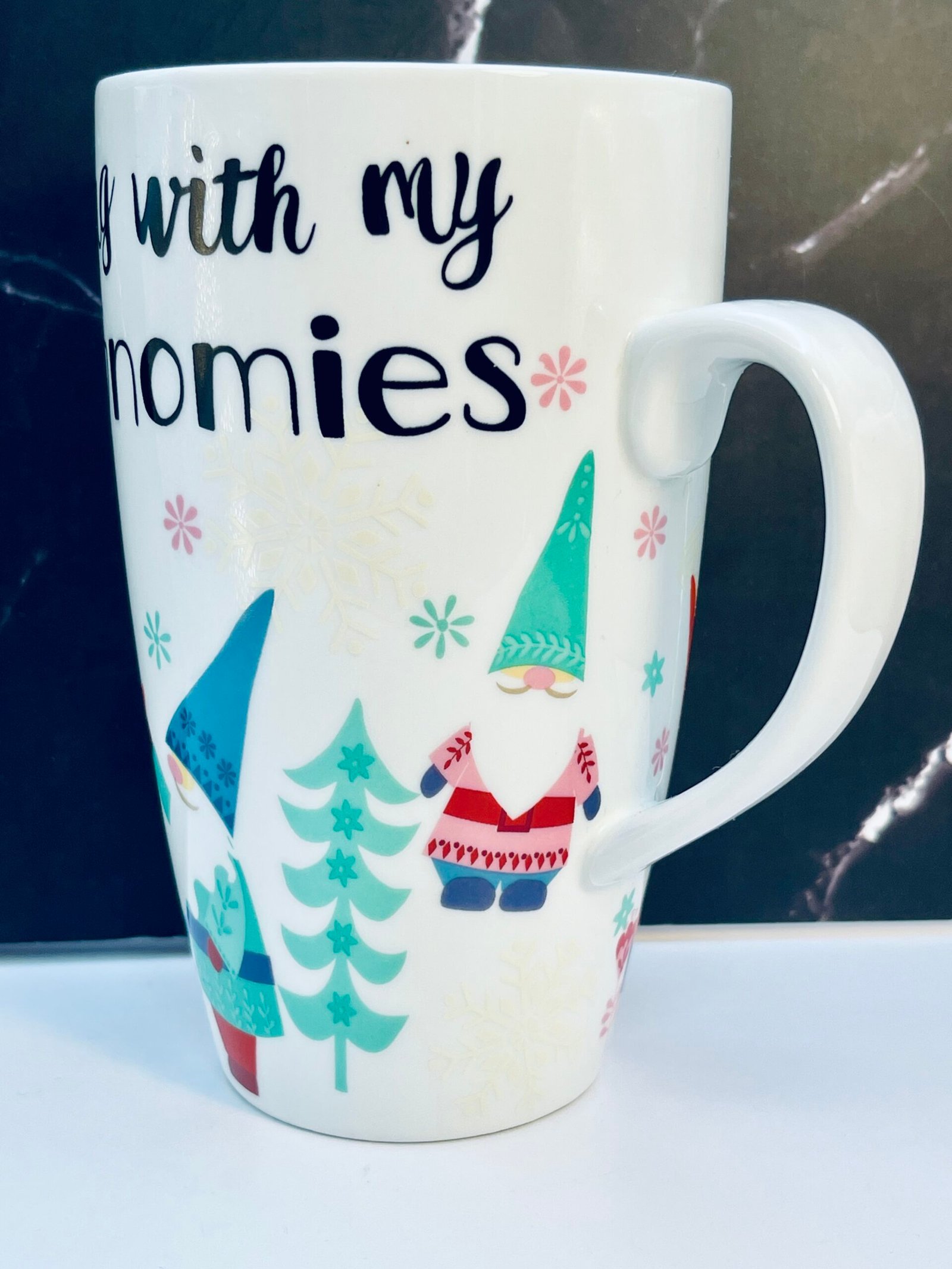 Festive ceramic coffee cup with snowflakes and trees