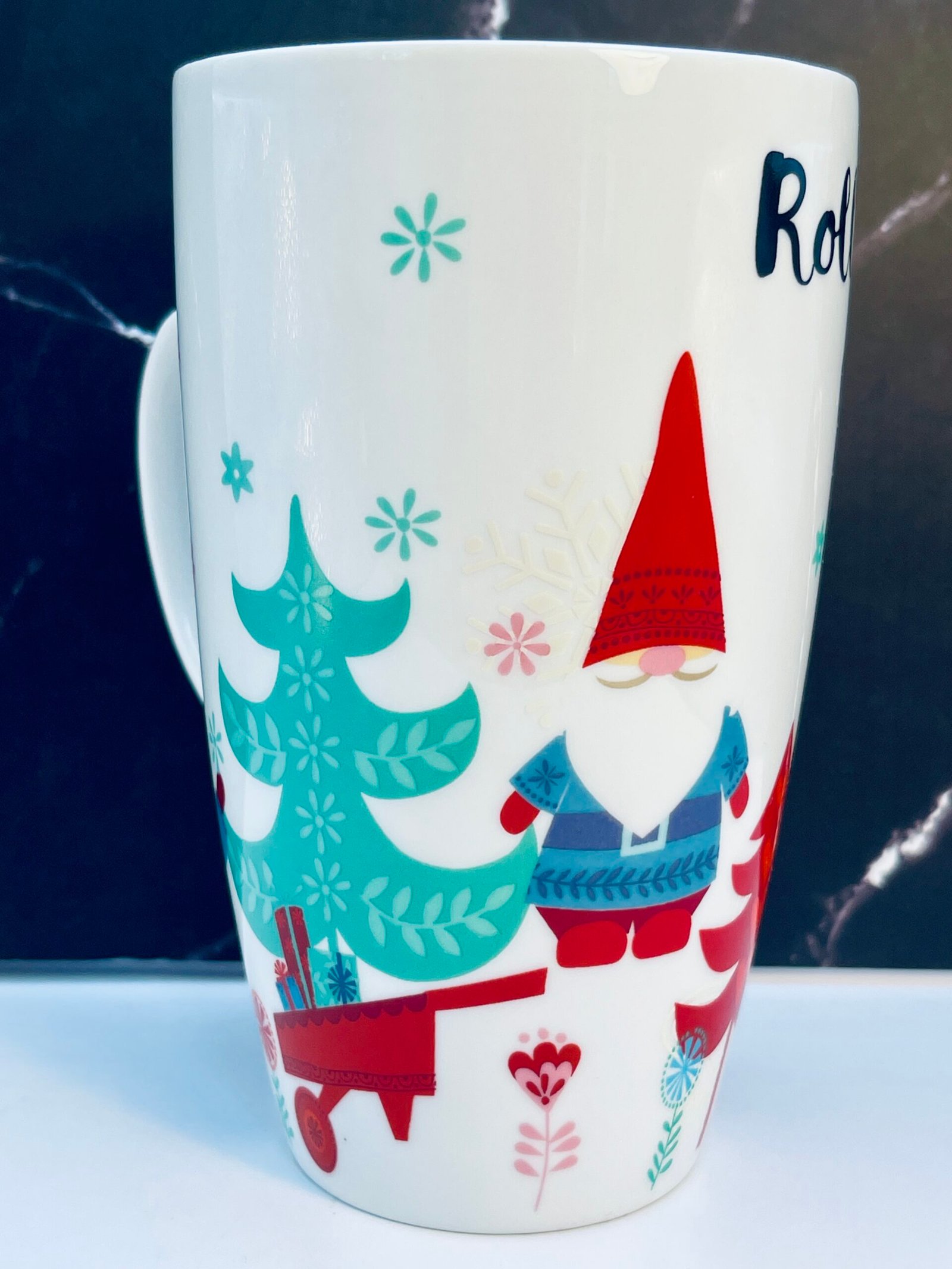 Festive ceramic coffee cup with snowflakes and trees