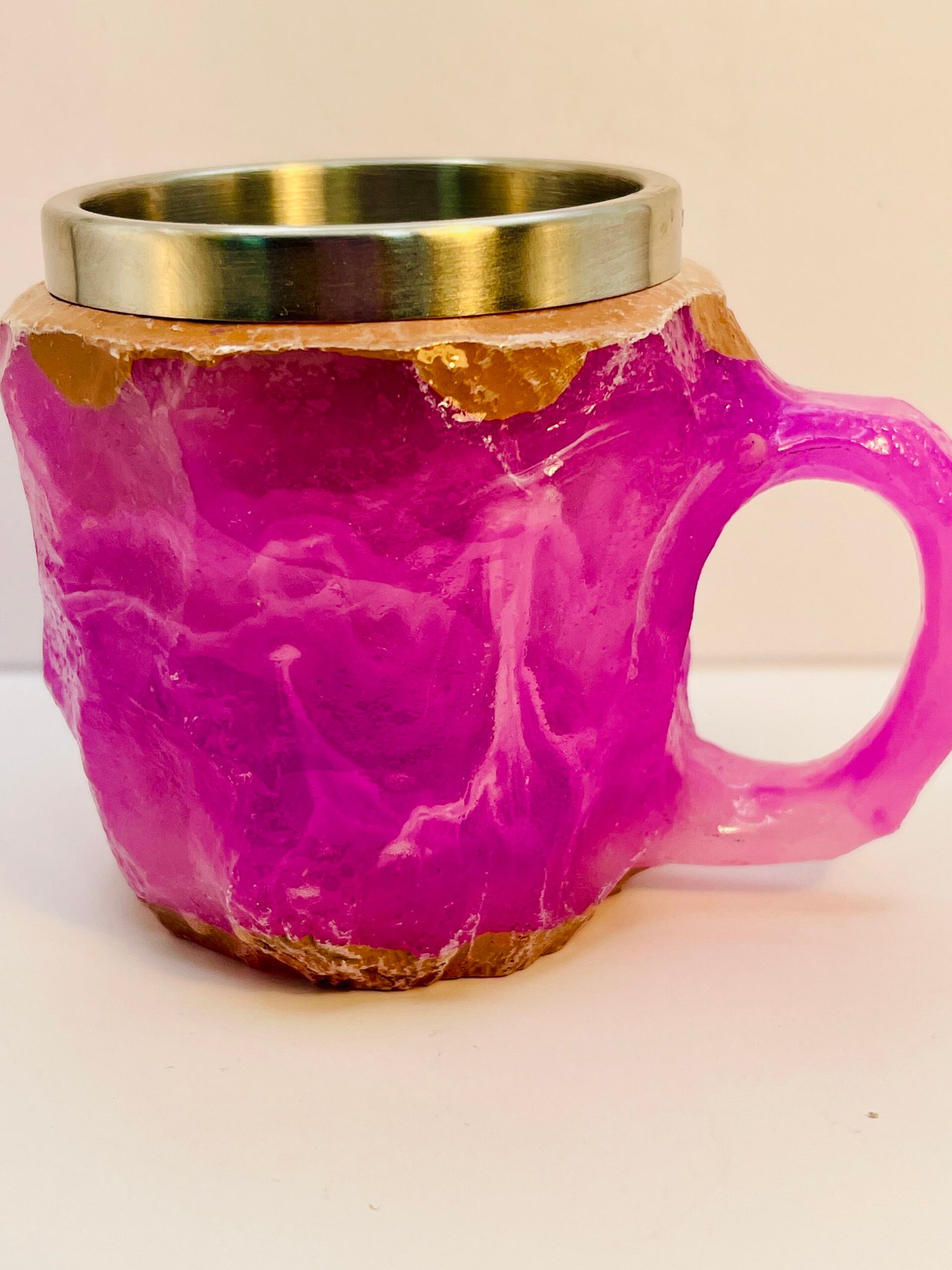 Faux crystal resin coffee cup glowing in light