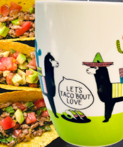 Pfaltzgraff taco llama mug displayed with tacos and Let's Taco 'Bout Love desig