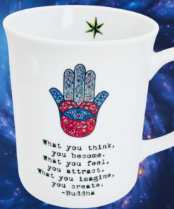 Buddha Hamsa Hand Inspirational Mug styled against cosmic galaxy background with spiritual aesthetic