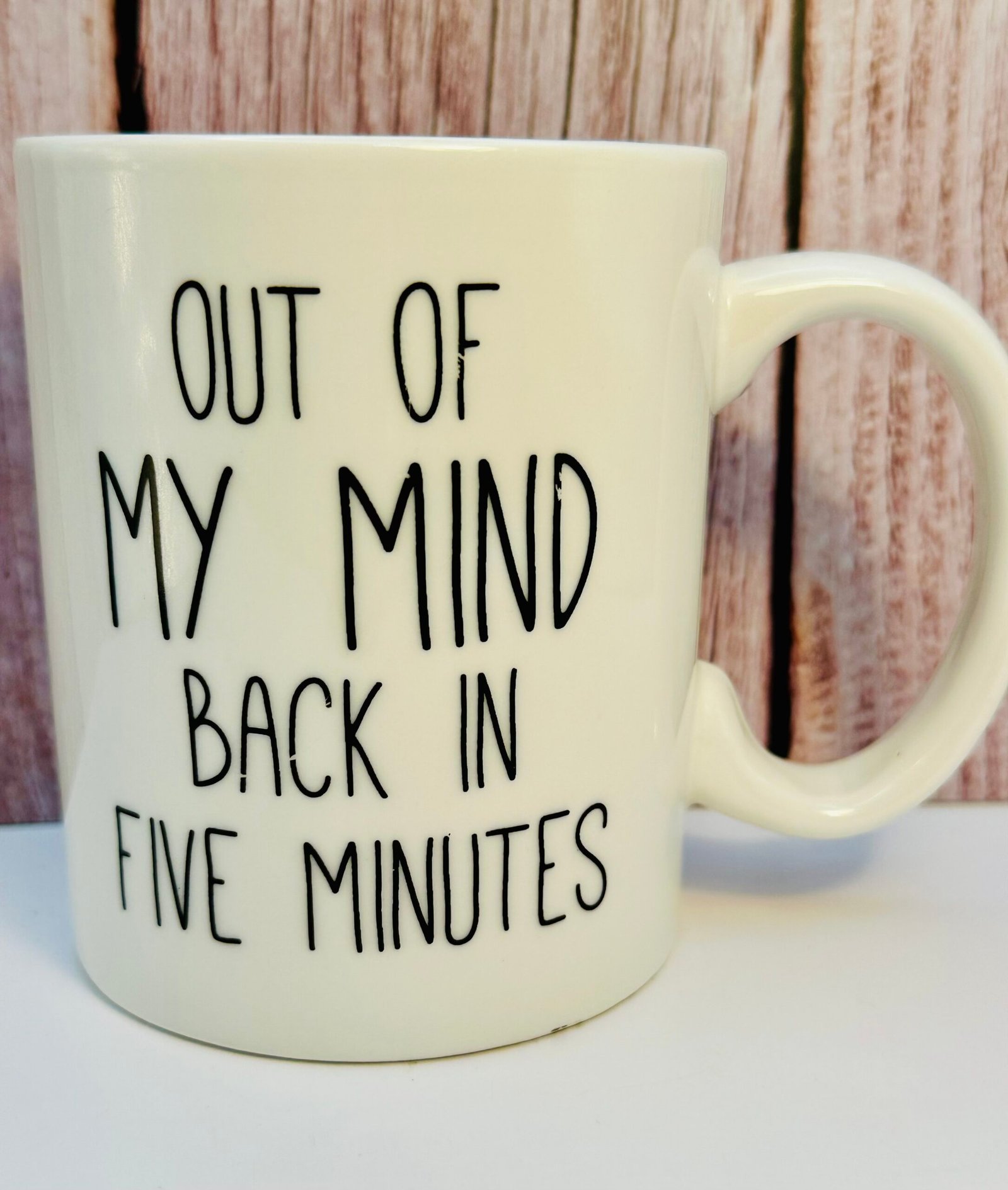 White ceramic novelty mug with humorous quote