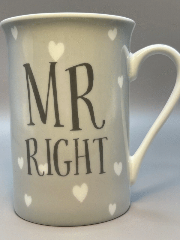 This is a whimsical Mr. Right Gray Coffee Cup with Hearts.