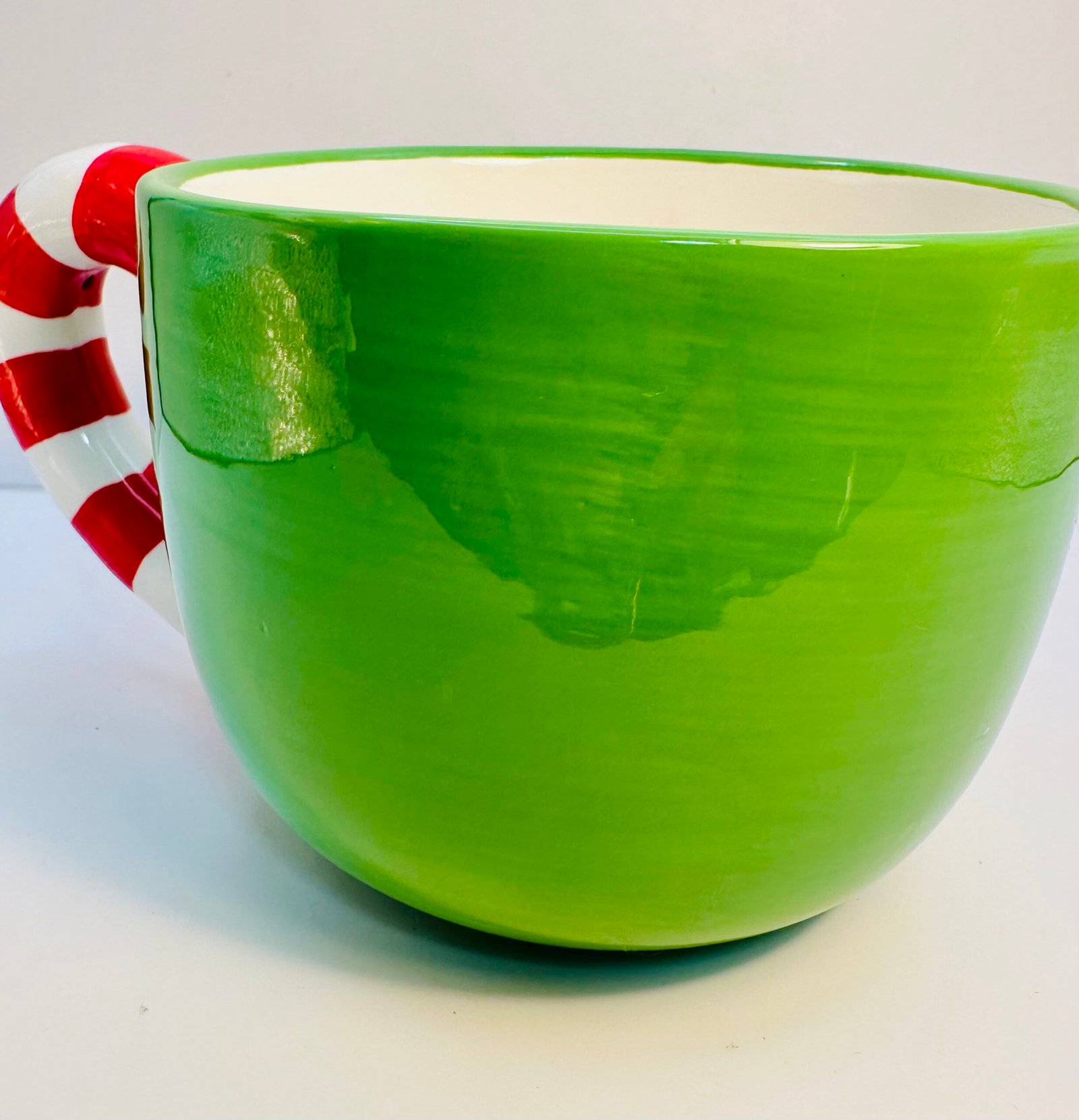 Green Sandra Magsamen Christmas mug with candy cane handle