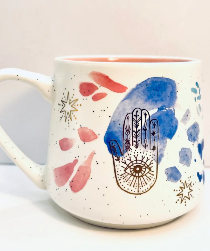 This Stay Wild Moon Child Hamsa Mug is the perfect #cupofmood and a mesmerizing blend of bohemian energy, spiritual symbolism, and watercolor whimsy.