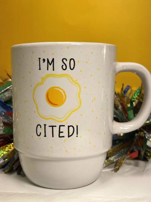 You’ll be eggcited about drinking your morning brew in this egg lovers perfect #cupofmood. This foodie lovers mug has the funny egg saying and a sunnyside up egg on both sides of this food pun coffee cup.
