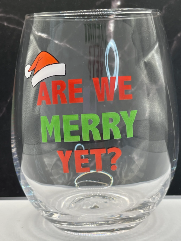 Get into the holiday spirit with the Merry Yet Stemless Wine Glass! It’s the perfect #cupofmood for a festive holiday season.