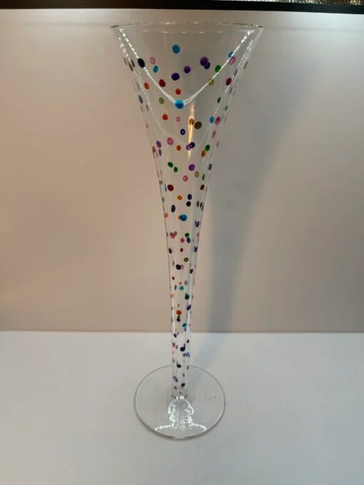 This Colorful Confetti Champagne Flute is a vibrant 8-ounce hand-painted glass is the life of the party. Especially featuring an explosion of multicolor polka dots scattered all over the clear champagne flute.