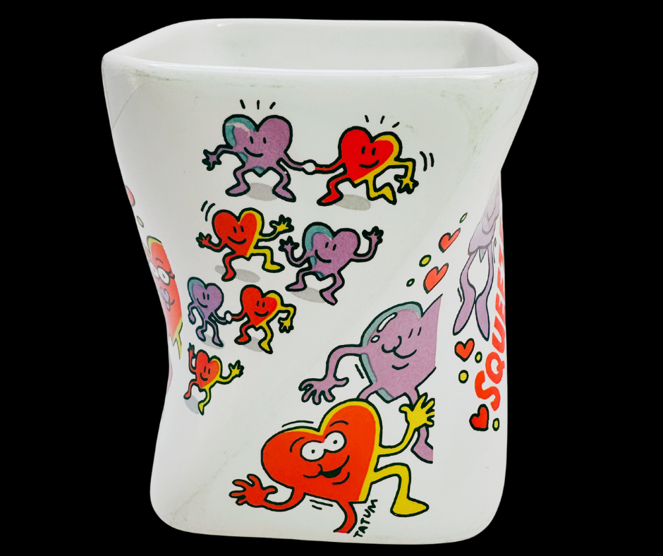 Vintage Dakin Hug Me Love Me Mug side middle view showing artwork wrap and heart details