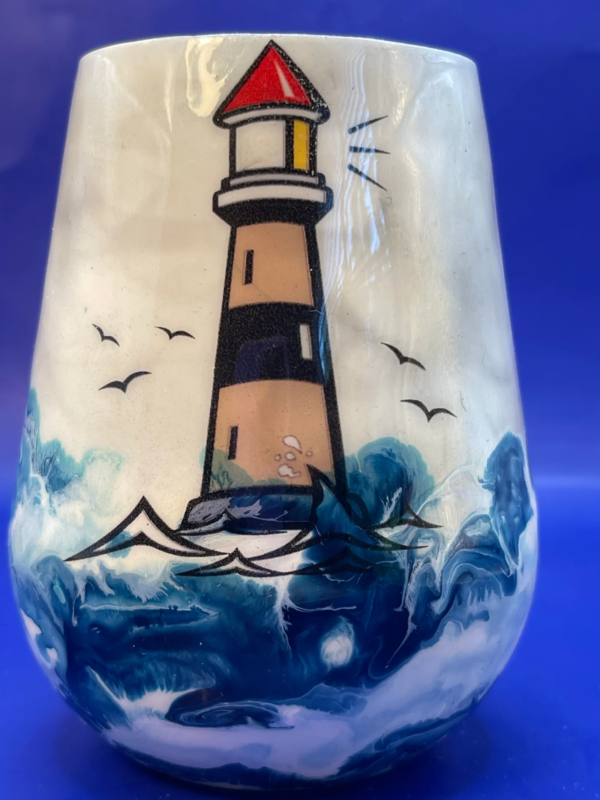 Raise a toast to inspiration and coastal elegance with the Inspirational Lighthouse Stemless Wine Glass.