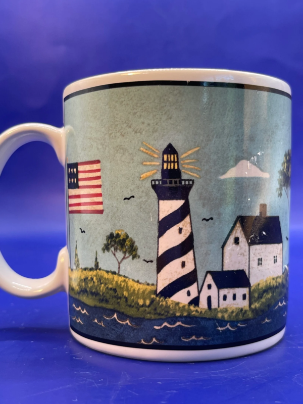 Elevate your morning ritual with the Sakura Coastal Breeze Lighthouse Mug.