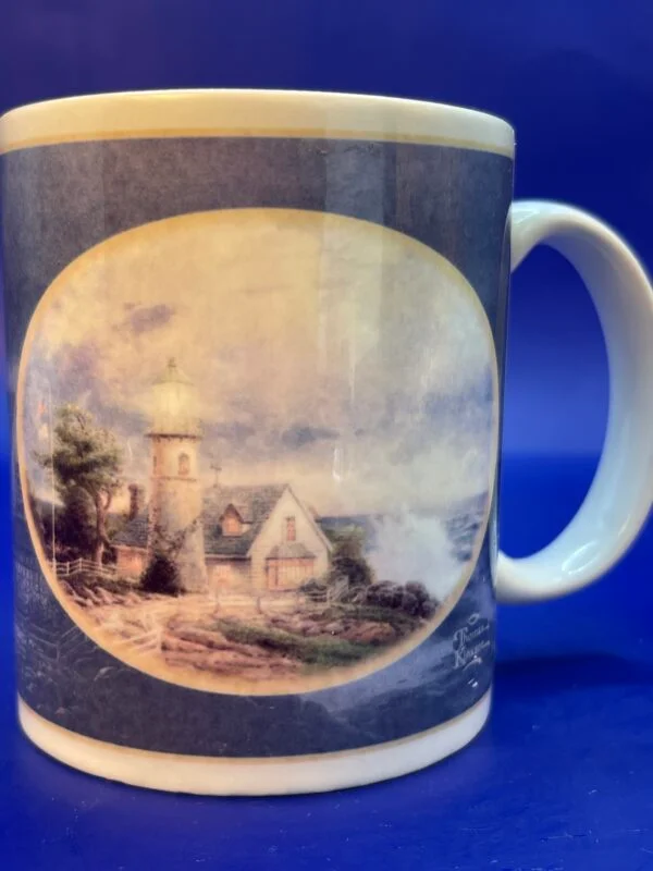 Experience the serene beauty of a winter wonderland with our Thomas Kinkade Light Storm Mug. It’s the perfect #cupofmood and vintage 1998 gem.