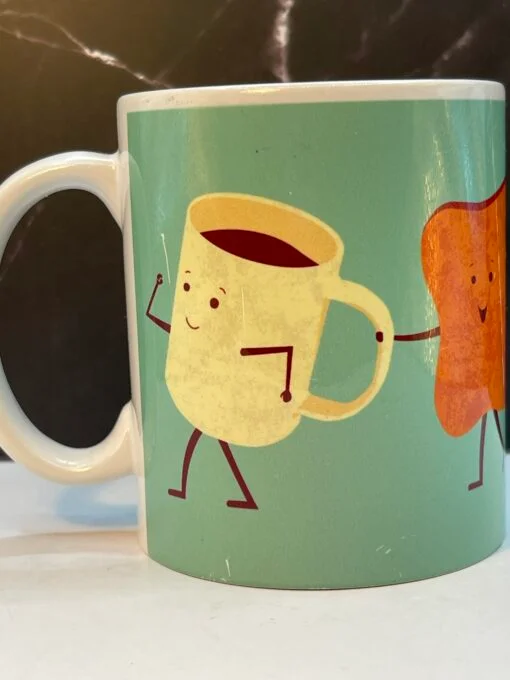 Wake up and smell the coffee with the delightful Let’s Have Breakfast Mug!