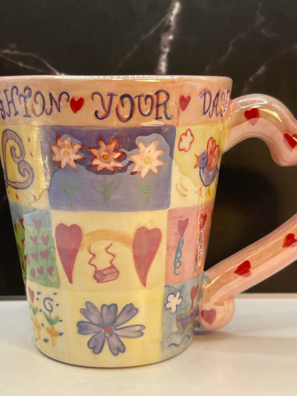 This 14-ounce white ceramic Brighton Your Day Valentine Mug is a celebration of vibrant design and heartfelt sentiment.