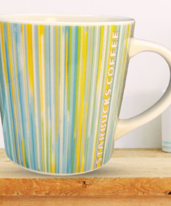 Starbucks 2005 Pastel Stripe Mug styled on wooden shelf in kitchen setting