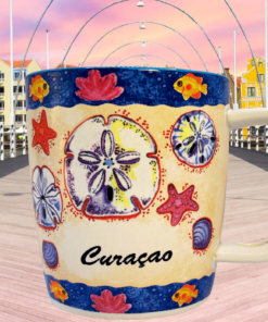 Back view of Curacao mug highlighting wraparound beach design with tropical colors and shell patterns